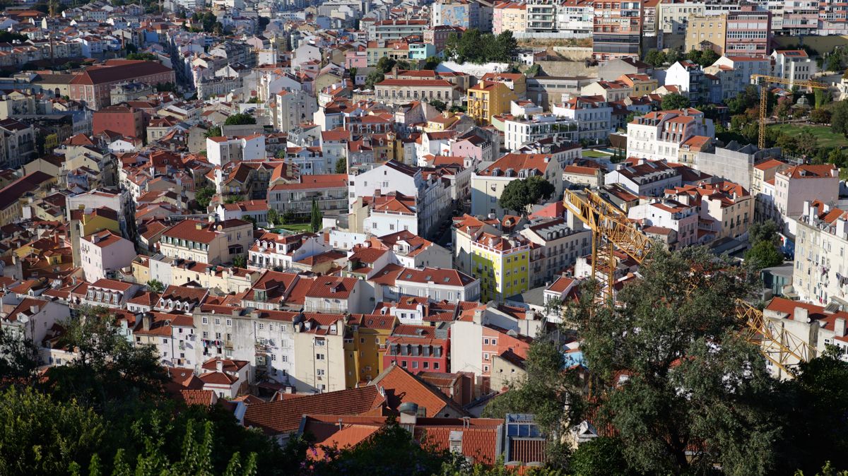 Sunlit Lisbon rooftops with a thin slice in focus